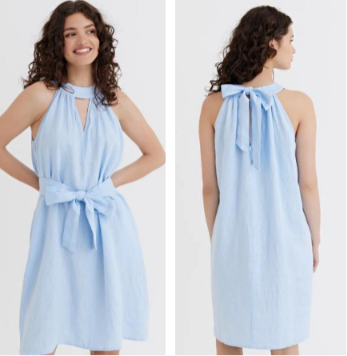 Front and back view of a woman showcasing a solid light blue 100% pure linen sleeveless halter-neck mini dress with a front waist-tie and an open back bow.