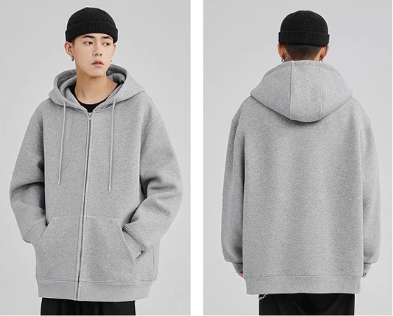 Front and back view of a man showcasing a sophisticated grey zip-up hooded jacket with soft matching drawstrings paired with black trousers.